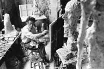 Giacometti painting in his studio