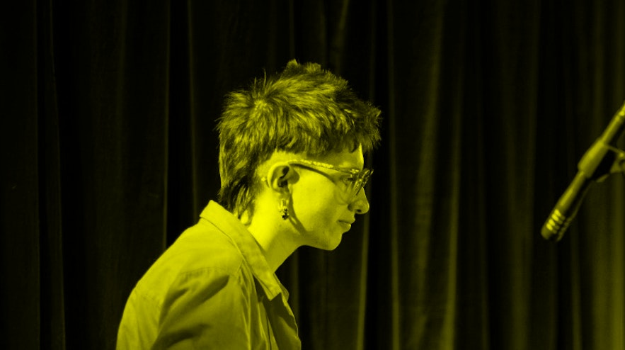 Person standing at an instrument holding multiple mallets.