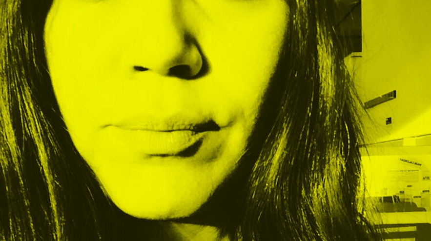 Closeup photo of a persons face with long dark hair